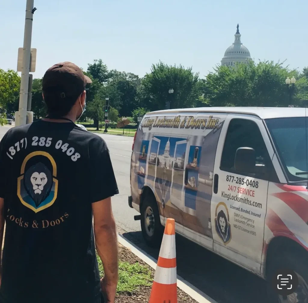 King Locksmith And Doors Inc. locksmith in Washington DC standing beside a branded locksmith van near the U.S. Capitol, providing trusted locksmith and door services in Washington DC.